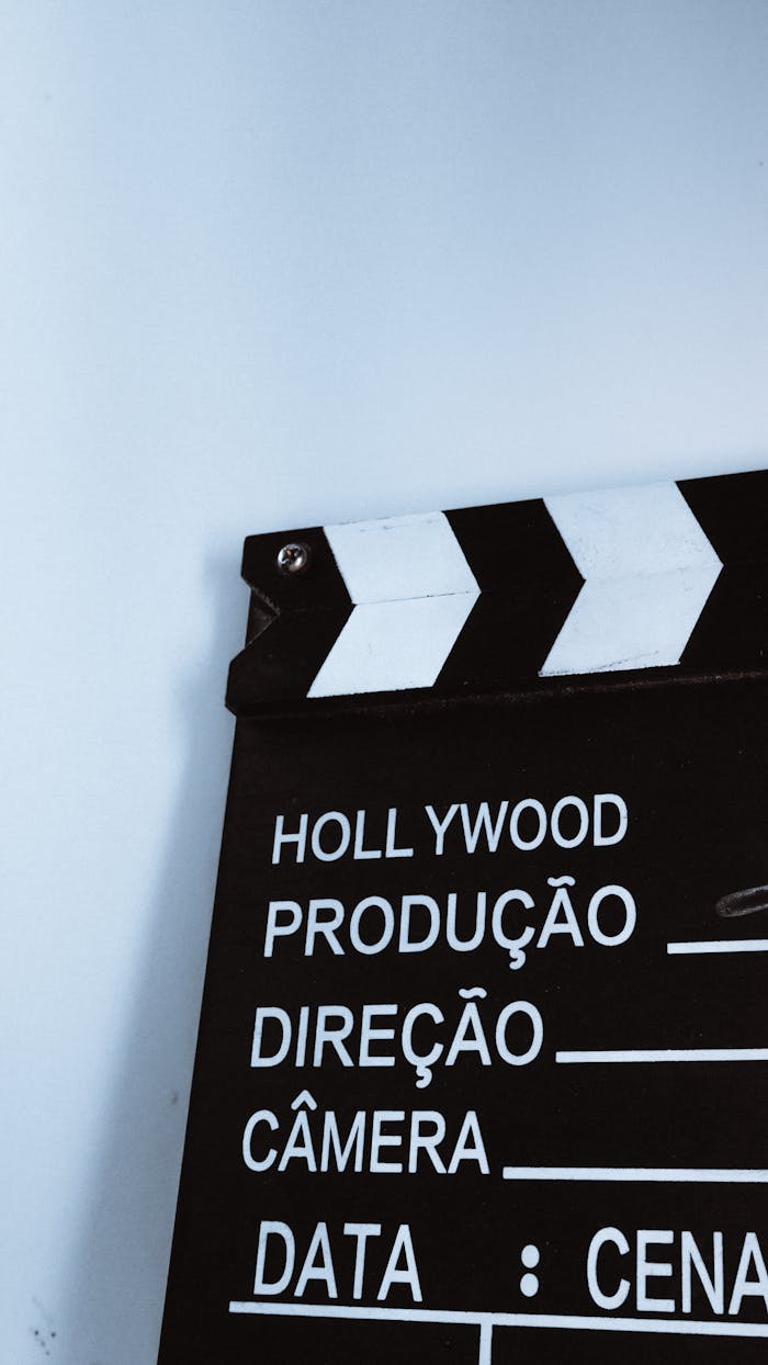 Close-up vertical shot of a clapperboard with text, ideal for film and media themes.